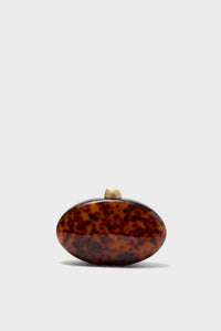 Caramel Tortoise Eviana Clutch: An effortlessly classic, high-end acrylic evening bag with a fun tortoiseshell pattern, featuring a gold clasp and removable chain strap.