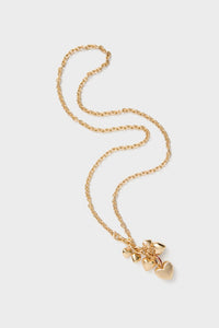 Gold The Family of Hearts Pendant: A classic gold-tone chain necklace with an effortless cluster of heart charms, featuring ruby crystal pave details and a high-end lobster clasp closure.