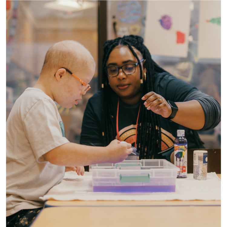 Art therapist working with a child.