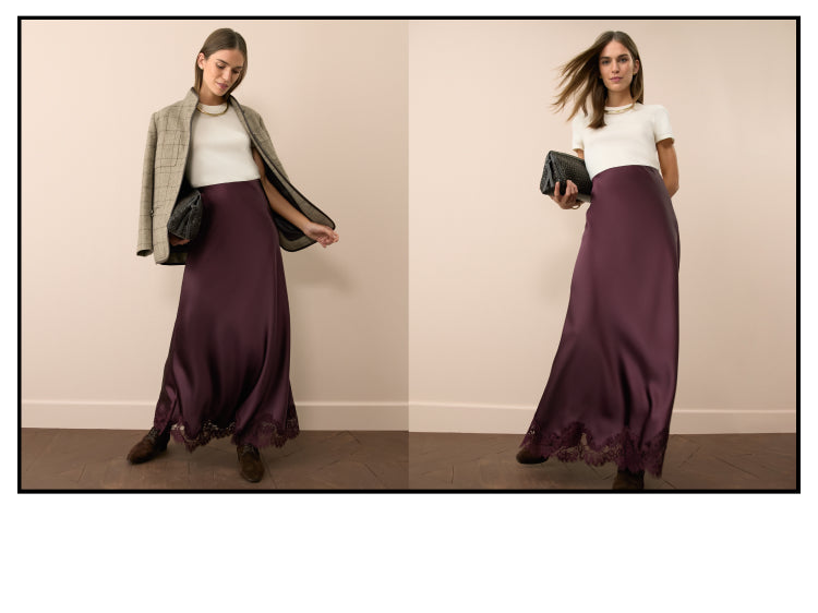 Woman in a cream cashmere tee and an oxblood satin skirt.