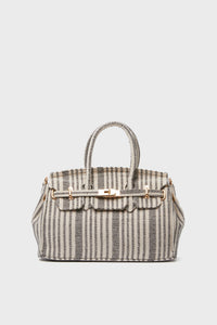 The Urban Expressions satchel is a structured bag with vertical black and white stripes, dual top handles, and gold hardware. Part of our animal-friendly handbag collection.