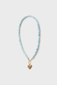 A HART for Tuckernuck exclusive beaded necklace with light blue opal beads and a gold heart charm.