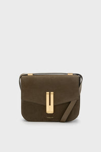 The Demellier Olive Suede Vancouver Bag is a brown rectangular crossbody with gold hardware and a front flap closure, handcrafted in leather for everyday elegance.