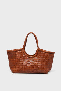 A brown handwoven tote basket bag by Dragon Diffusion is shown, featuring two handles and crafted with intricate detail.