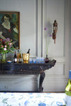 Vita Large Ice Bucket with faceted design on elegant bar console; a classic, high-end piece for effortless entertaining.