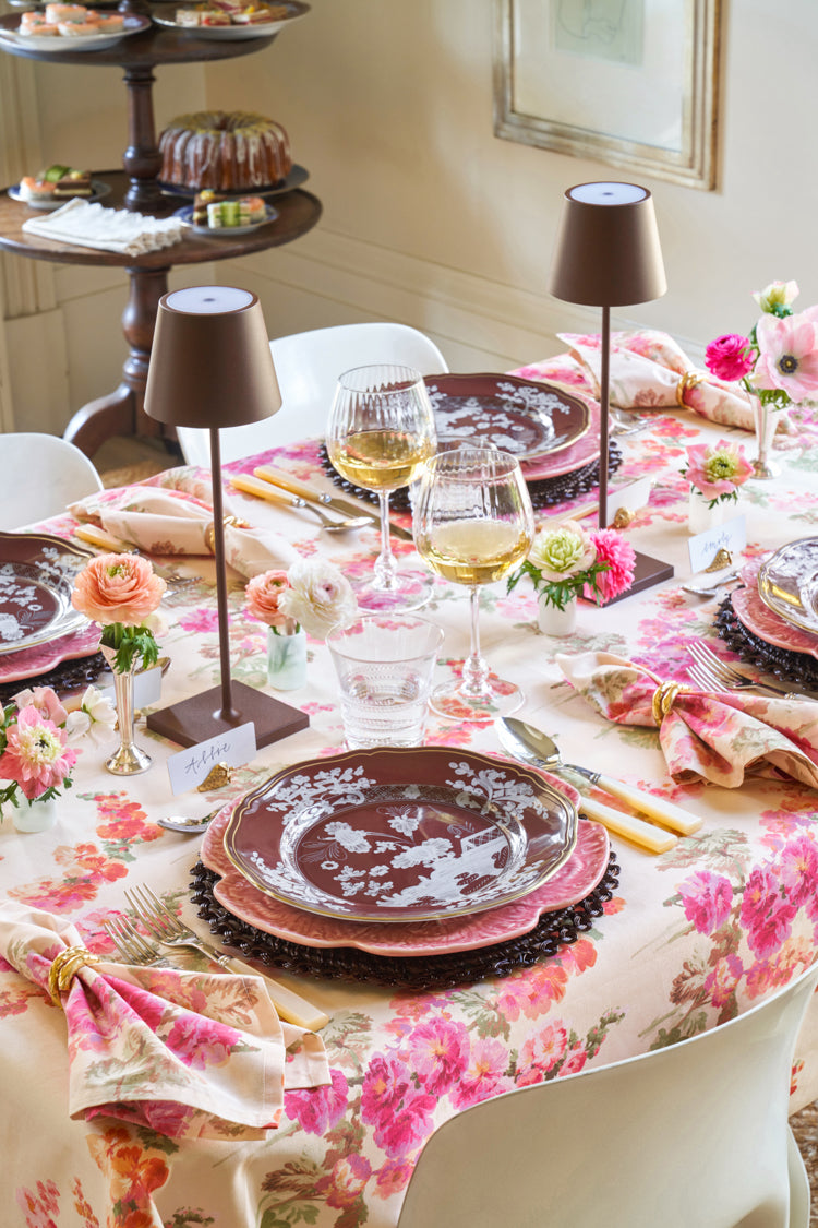 Ella Small Tumbler elegantly graces a classic dining setup with its high-end, effortlessly fun design, surrounded by layered place settings and floral accents.