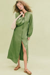 Young woman models the classic, effortless Cedar Green Button Down Granier Dress with a relaxed fit, billowy sleeves, and versatile styling for a fun, high-end look.