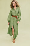 Woman models a classic, olive-green shirt-dress paired with a high-end, tan woven belt with an oval buckle, exemplifying effortless style and fun sophistication.