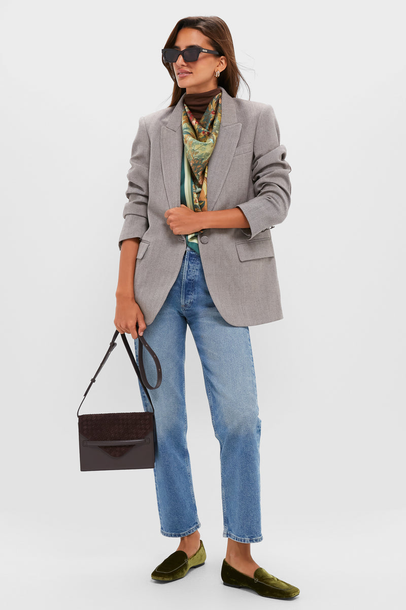 Model showcasing a classic, high-end look with the Brown Leather Stevie Crossbody, featuring a woven suede flap and effortless style, ideal for fun, polished, everyday wear.