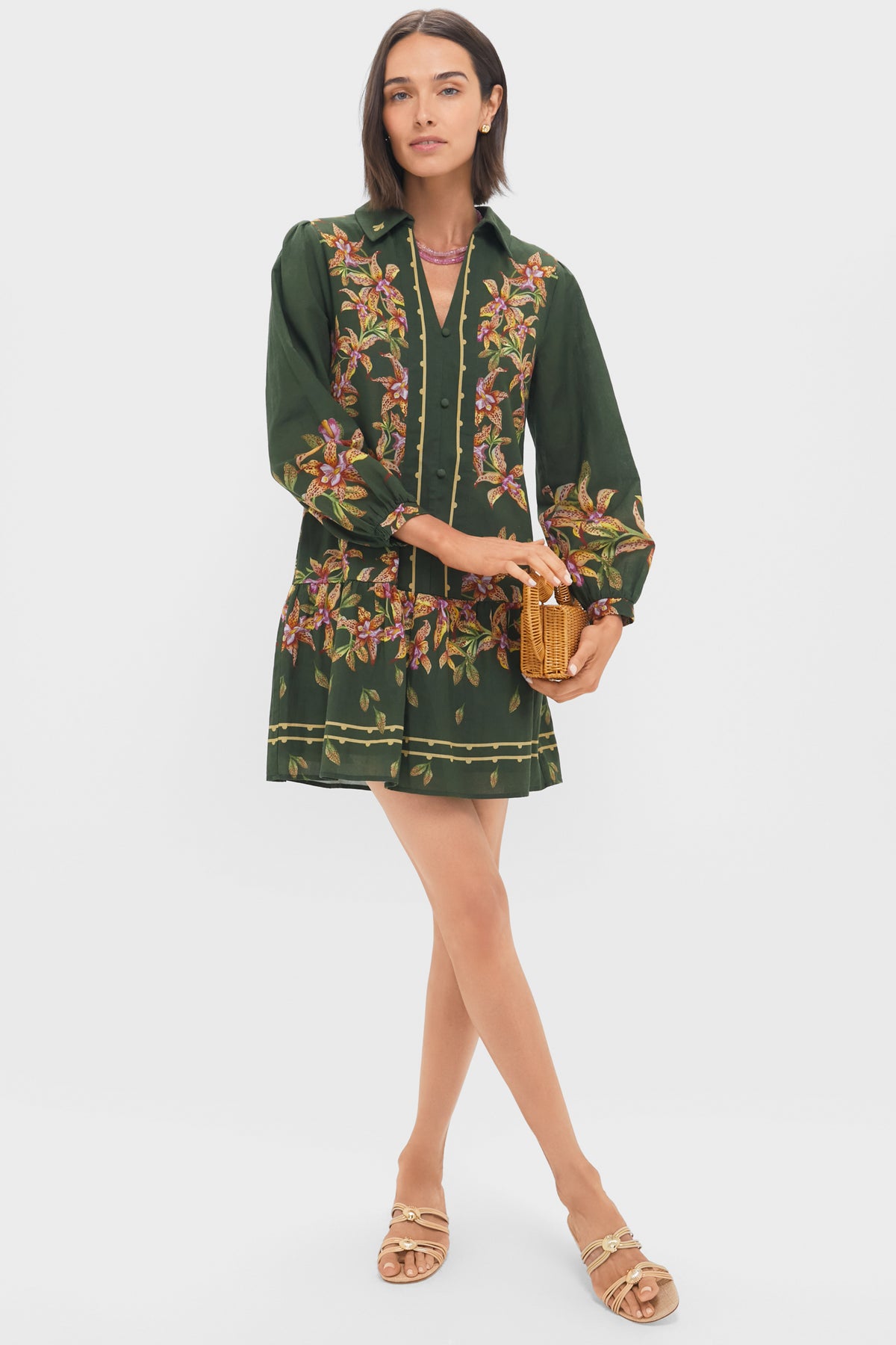 Hunter Lilly Porter Mini Dress exudes classic elegance with its chic V-neck, puffed sleeves, and shirred hem, effortlessly blending high-end style for fun, versatile occasions.