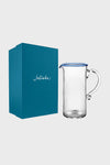 Chambray Nell Pitcher, a classic, high-end glass piece with ribbed texture and blue-tinted rim, offers effortless elegance, perfect for fun gatherings.