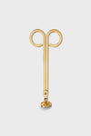 Gold metal earring by AERIN, designed as an abstract ram’s head with two spiraled curves at the top and a straight stem ending in an earring back—ideal for lovers of luxury style.