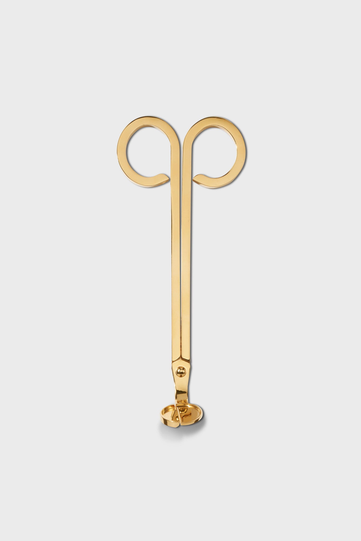 Gold metal earring by AERIN, designed as an abstract ram’s head with two spiraled curves at the top and a straight stem ending in an earring back—ideal for lovers of luxury style.