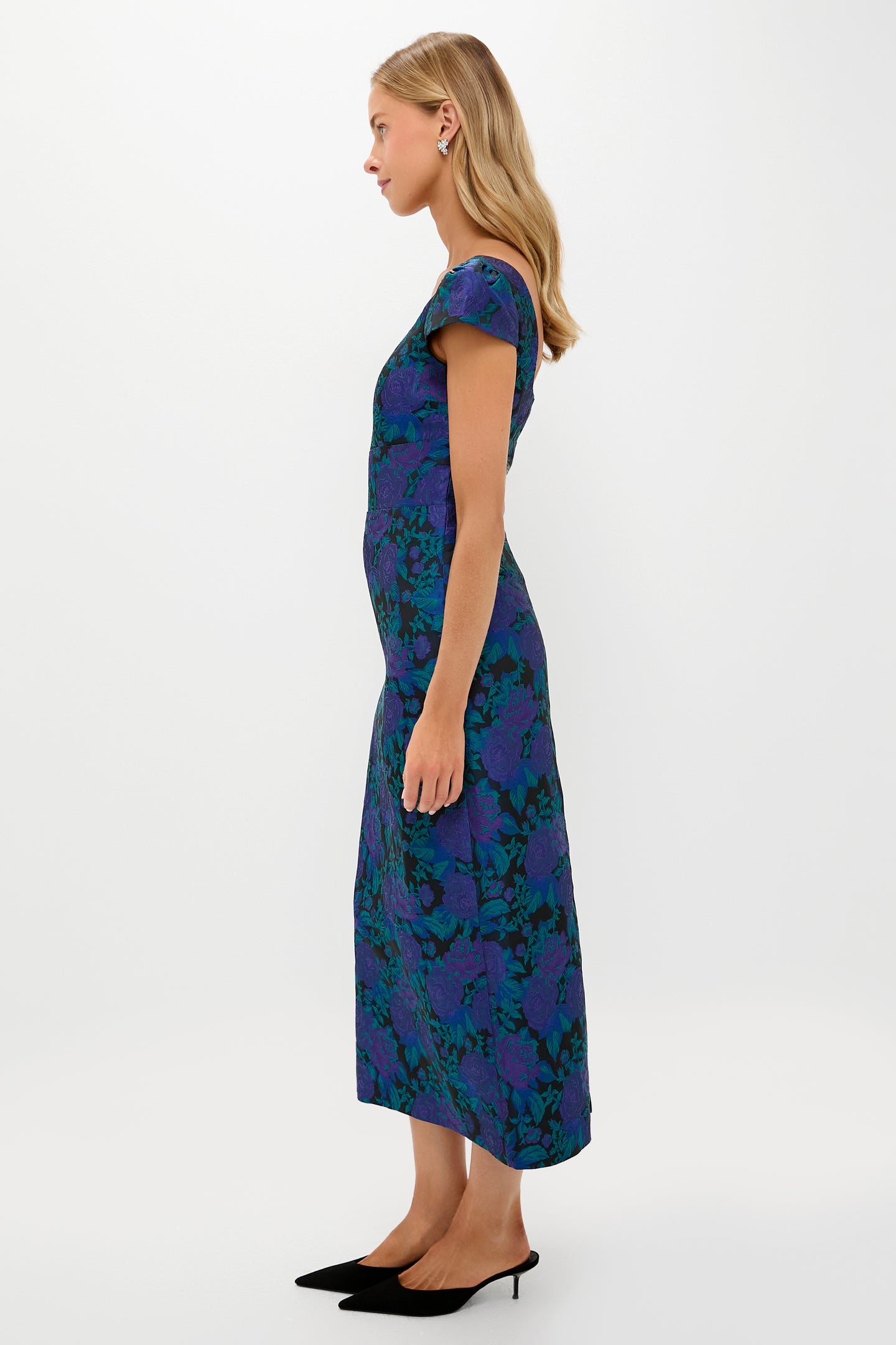 Model in profile wearing the classic Navy & Indigo Jacquard Archibald Maxi Dress with cap sleeves and kitten-heel mules, exuding effortless, high-end elegance.