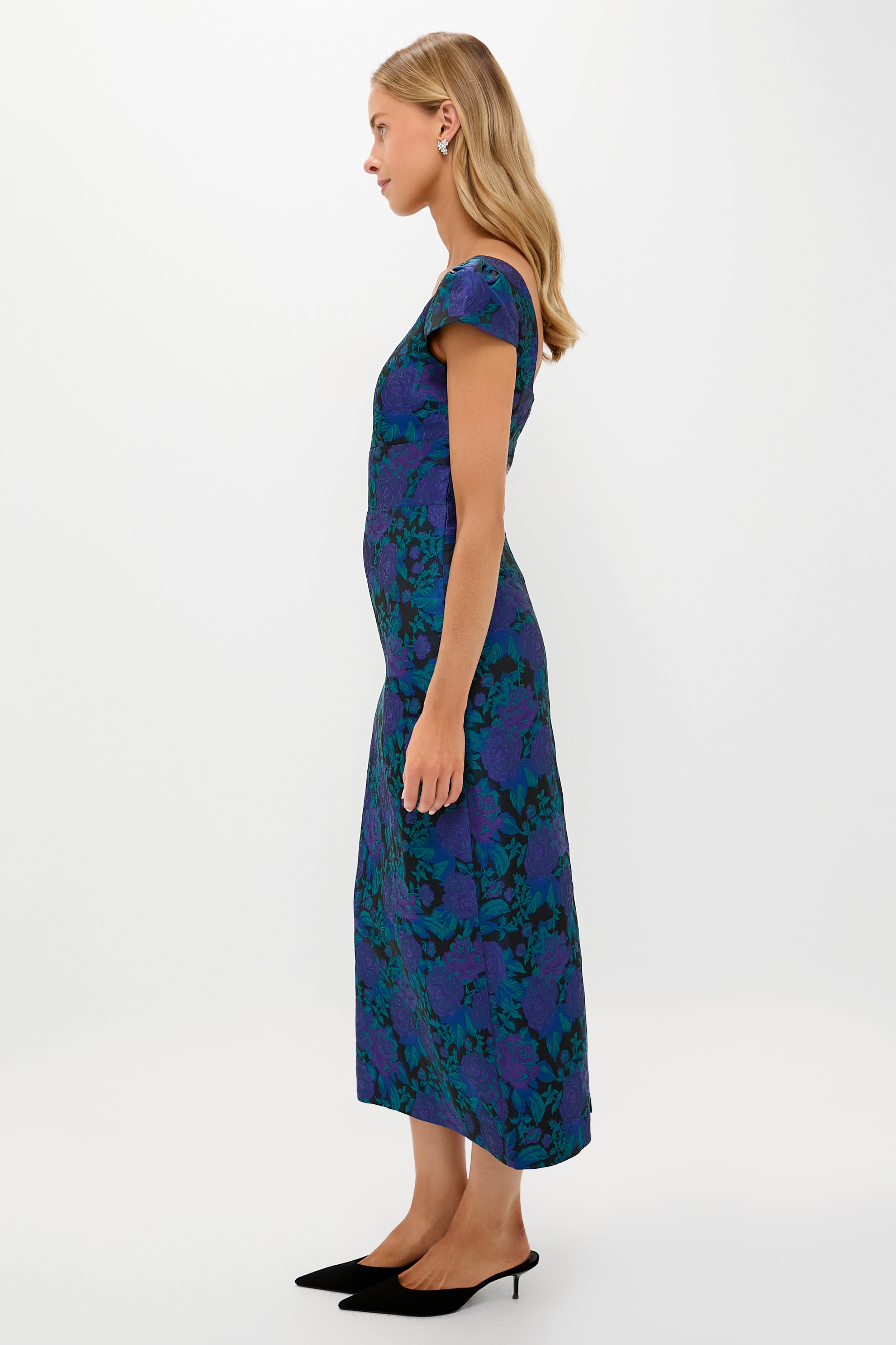 Model in profile wearing the classic Navy & Indigo Jacquard Archibald Maxi Dress with cap sleeves and kitten-heel mules, exuding effortless, high-end elegance.