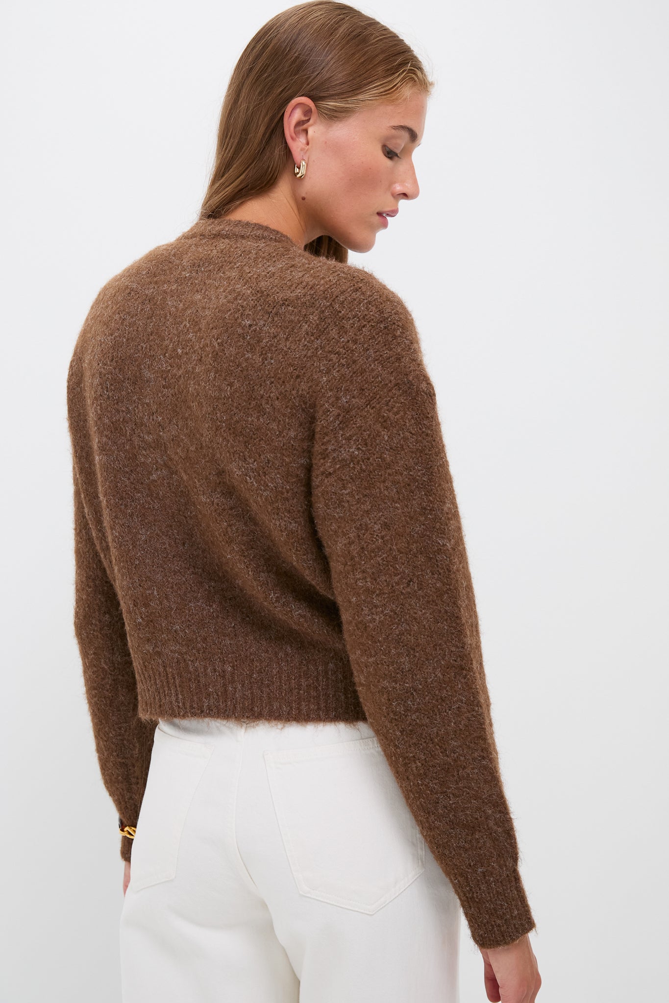 Brown Morgan Cardigan exudes classic elegance with its gold-tone, crystal-embellished buttons, offering an effortless, high-end look over cream jeans for fun sophistication.