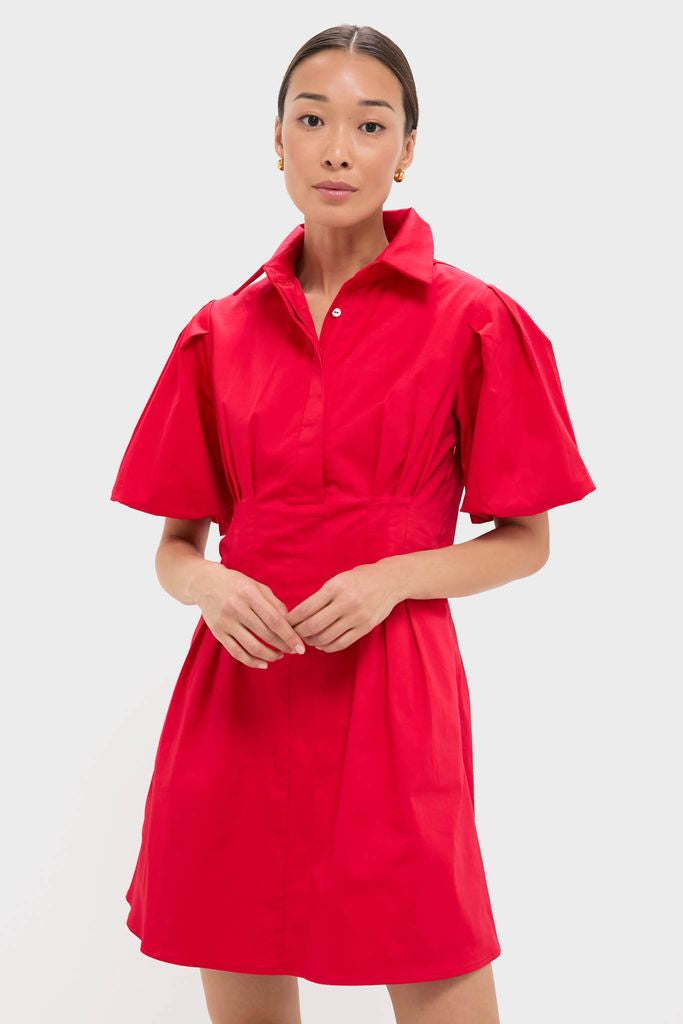 Person wearing the Red Mini Delaney Dress with a classic pointed collar, puff sleeves, and a fitted waist, showcasing an effortless, high-end style for fun occasions.
