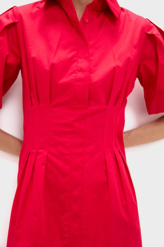 Red Mini Delaney Dress with classic spread collar and puff sleeves, featuring an effortless fit with pleats and buttons. Ideal for fun, high-end occasions.