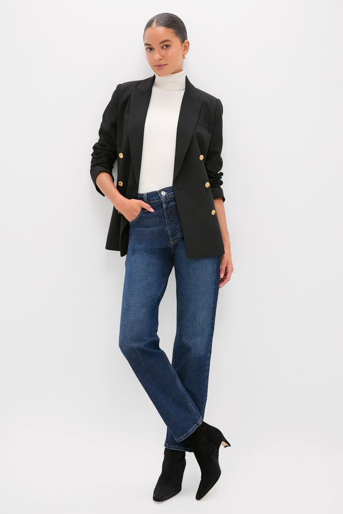 Woman models the Black Diana Blazer, showcasing its effortless, classic design with gold buttons and oversized fit, embodying high-end fashion for a fun, timeless look.