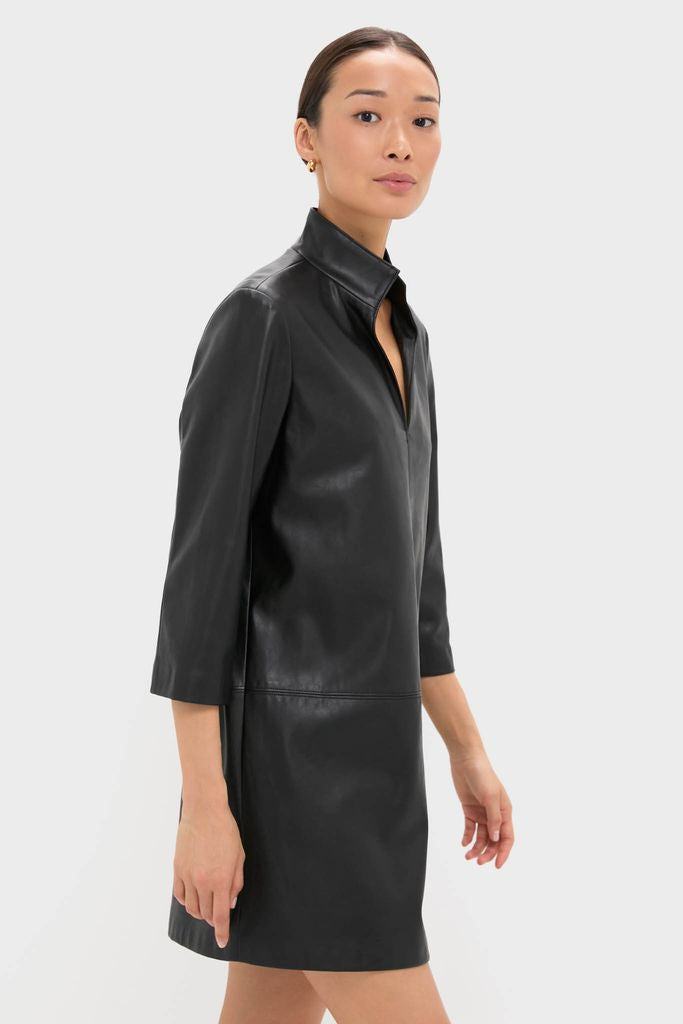 Effortlessly cool, the Black Leather Clifton Dress showcases a classic stand collar and V-neck, embodying high-end style with its faux leather and three-quarter sleeves.