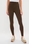 Classic Chocolate Brown High Rise Compression Spandex MacKenzie Legging, offering an effortless, high-end look with a flattering fit, styled with tan sneakers in a fun, studio setting.