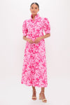 Woman models the Pink Textured Floral Ruffle Collar Louisa Maxi Dress, a classic, effortless, and fun high-end piece with puff sleeves, button front, and A-line skirt.