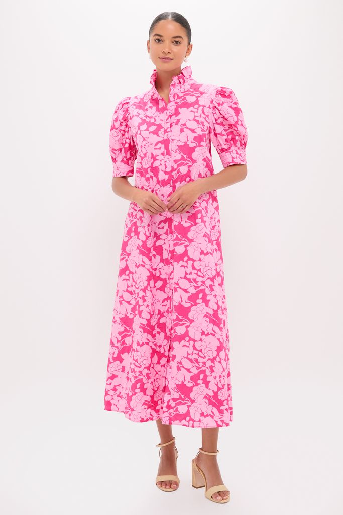 Woman models the Pink Textured Floral Ruffle Collar Louisa Maxi Dress, a classic, effortless, and fun high-end piece with puff sleeves, button front, and A-line skirt.