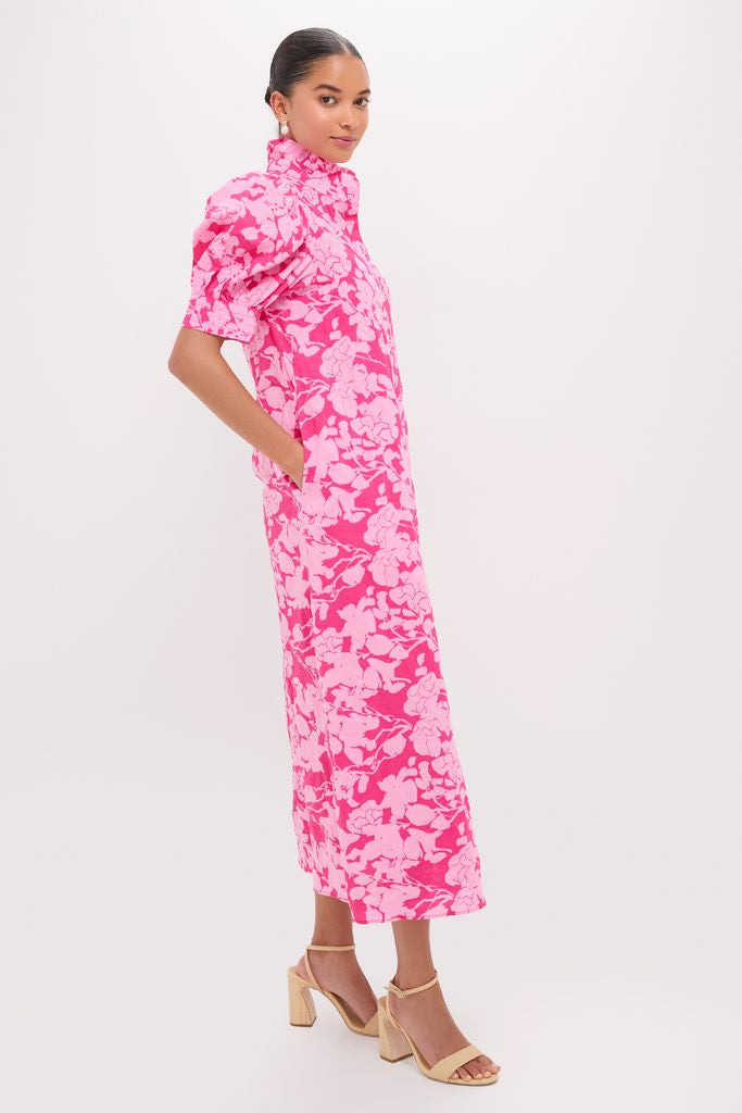 Model wearing Pink Textured Floral Ruffle Collar Louisa Maxi Dress with puff sleeves and nude sandals, exuding classic, effortless style ideal for fun, high-end occasions.