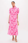 Woman modeling the Pink Textured Floral Ruffle Collar Louisa Maxi Dress, showcasing its classic, effortless style with puff sleeves and a fun, high-end floral print.