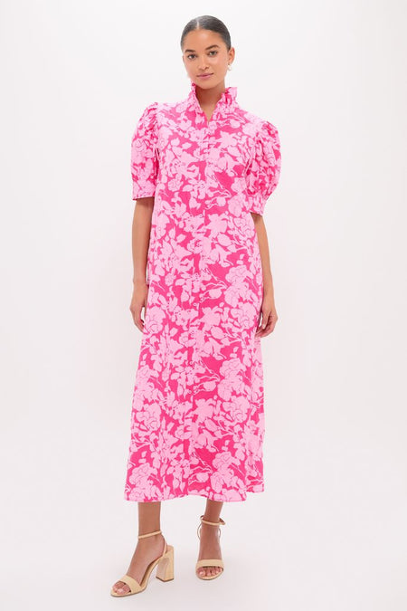 Woman modeling Pink Textured Floral Ruffle Collar Louisa Maxi Dress with puff sleeves and button-front, embodying classic, effortless style with a fun, high-end flair.