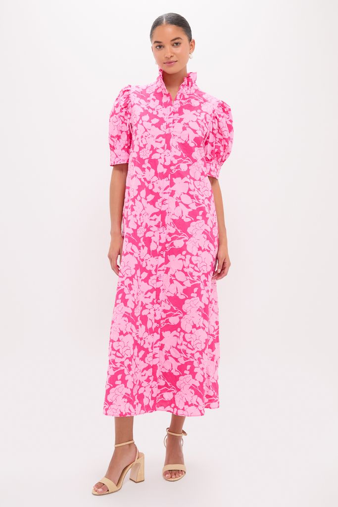Woman modeling Pink Textured Floral Ruffle Collar Louisa Maxi Dress with puff sleeves and button-front, embodying classic, effortless style with a fun, high-end flair.