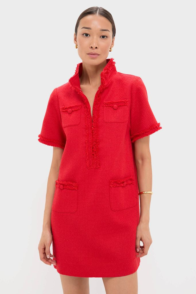 Woman models the Red Tweed Ophelia Dress, a classic mini with a fringe-trimmed standing collar, four pockets, and gold accessories, embodying effortless high-end style.