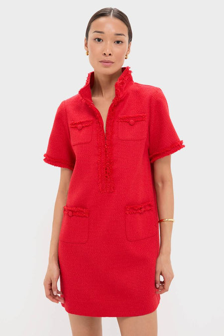 Woman models the Red Tweed Ophelia Dress, a classic mini with a fringe-trimmed standing collar, four pockets, and gold accessories, embodying effortless high-end style.