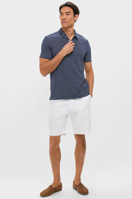 Classic and effortless, the Striped Navy Stretch Linen Polo pairs perfectly with white shorts and brown espadrilles, offering a high-end, fun look for any occasion.