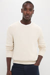 Young man wearing the Light Tan All Season Classic Crewneck, exuding classic, effortless style with its soft, textured knit, embodying high-end vintage inspiration for versatile, year-round wear.
