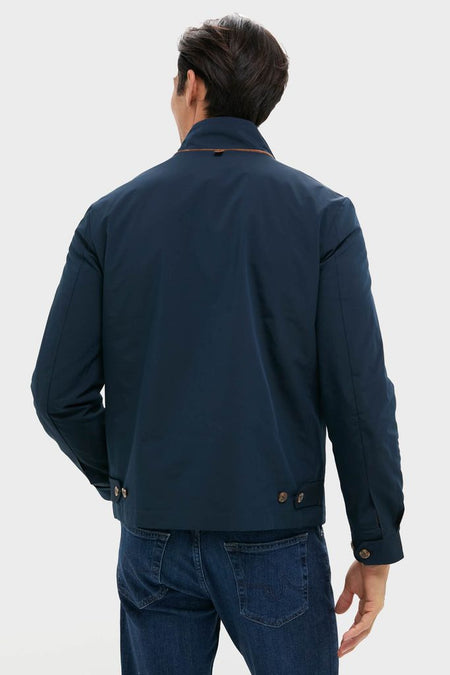 Back view of the Navy Blue Stanley Jacket, featuring buttoned tabs and suede-trimmed pockets, embodying a classic, effortless, and high-end style.