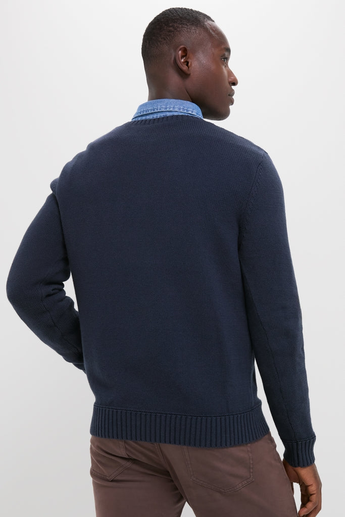 Man in Navy Blue All Season Classic Crewneck, showcasing an effortless, classic style with a textured knit and contrasting hem, embodying high-end vintage inspiration for versatile year-round wear.