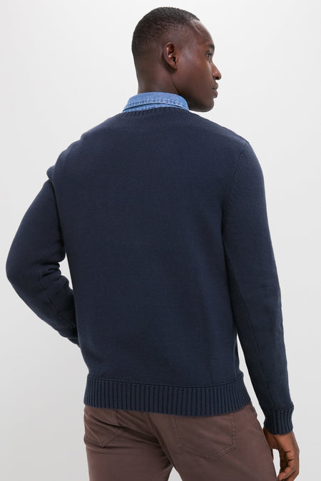 Man in Navy Blue All Season Classic Crewneck, showcasing an effortless, classic style with a textured knit and contrasting hem, embodying high-end vintage inspiration for versatile year-round wear.