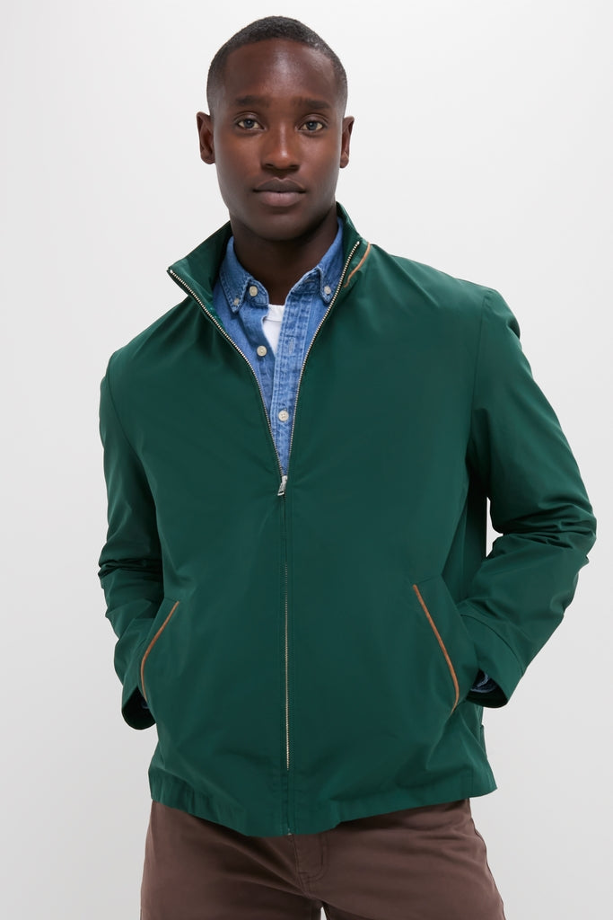 Young male model in Dark Green Stanley Jacket, showcasing a classic, effortless style with suede-trimmed pockets, perfect for high-end, fun outings or casual wear.