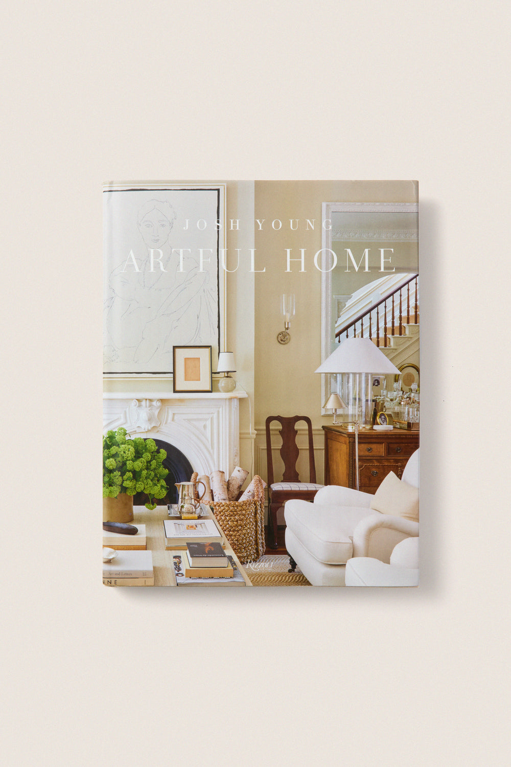 Cover of Artful Home by Josh Young, showcasing a classic, high-end living room with an effortless, fun design style featuring a fireplace, sofa, and elegant decor.