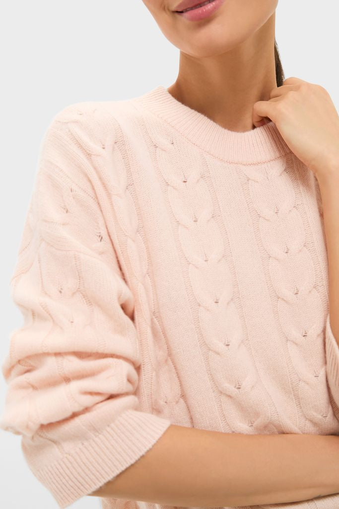 Soft Pink Cashmere Eloise Cable Knit Sweater showcasing a classic, effortless style with a cable pattern, crew neck, and relaxed fit for a high-end, fun look.