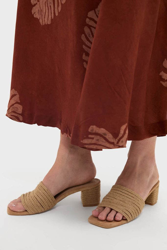 Natural Grenada Heels: Classic, effortless beige woven-rope slide sandals with a low block heel, perfect for summer fun. High-end multi-strap design adds elegance to any outfit.