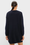 Woman in a Navy Vivianne Crewneck Dress, showcasing a classic, effortless style with drop shoulders and ribbed trim, perfect for fun, high-end occasions.