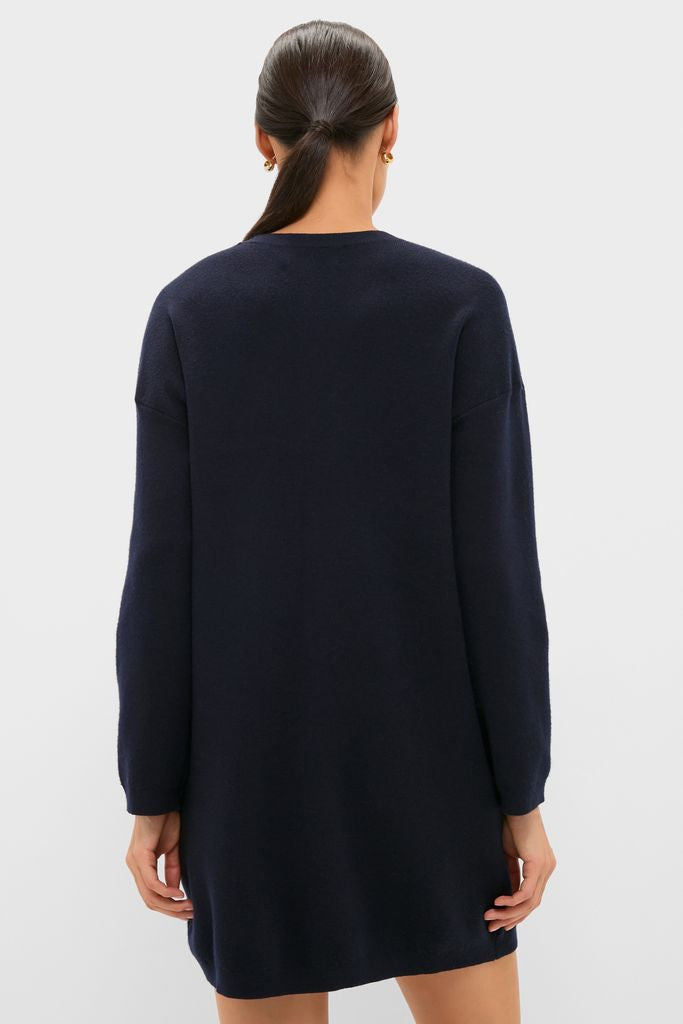 Woman in a Navy Vivianne Crewneck Dress, showcasing a classic, effortless style with drop shoulders and ribbed trim, perfect for fun, high-end occasions.