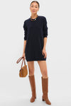 Navy Vivianne Crewneck Dress styled with a chunky necklace and cognac boots, exudes classic, effortless sophistication, perfect for fun, high-end occasions.