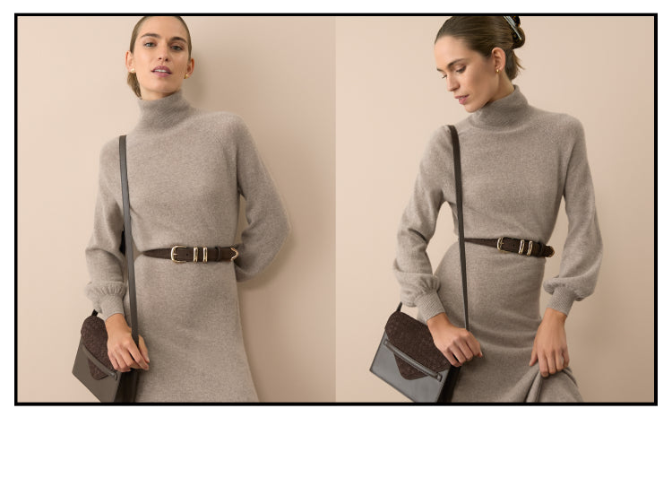 Woman in a gray sweater dress with a turtleneck and baloon sleeves. 