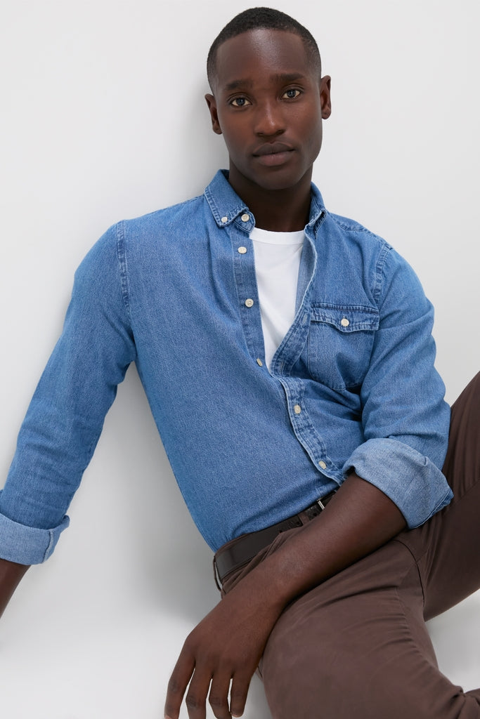 Young man in an effortless, classic style wearing the Dark Indigo Washed Denim Shirt, perfect for a fun, high-end look by Tuckernuck.