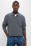 Young man models the classic Charcoal Merino Waffle Polo, effortlessly styled with medium-wash jeans for a high-end, fun, and confident look.