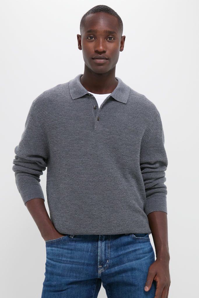 Young man models the classic Charcoal Merino Waffle Polo, effortlessly styled with medium-wash jeans for a high-end, fun, and confident look.