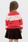 Young girl in a classic Red Lamb Sweater with sheep motifs and button front, paired with a flared skirt, embodying effortless, high-end, fun style.